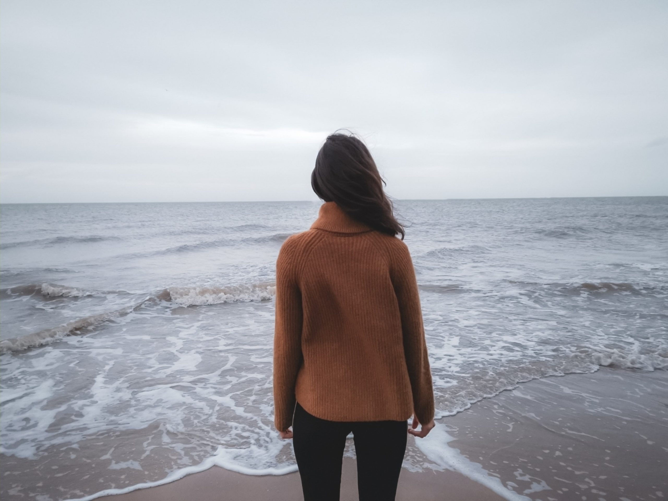 Woman with Anxiety staring into the ocean