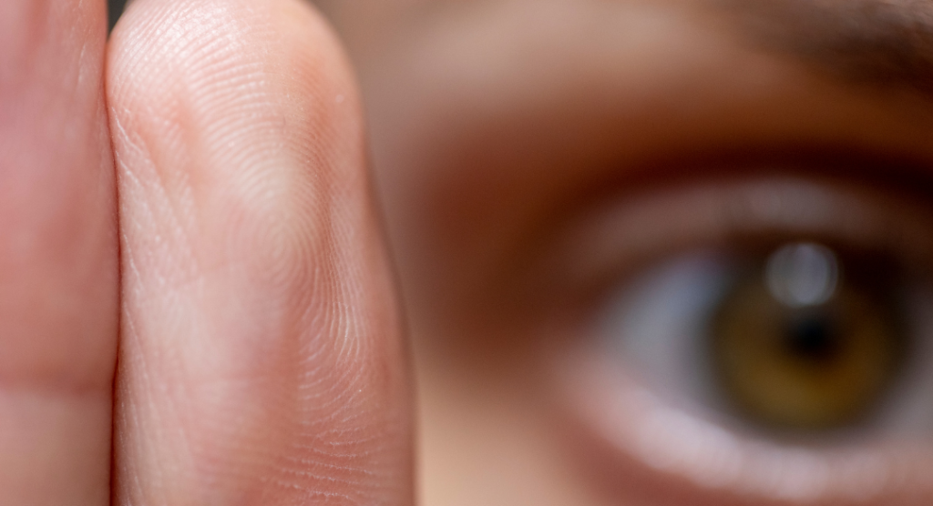 Person reflecting in a quiet space — recognizing 7 signs trauma may be affecting daily life